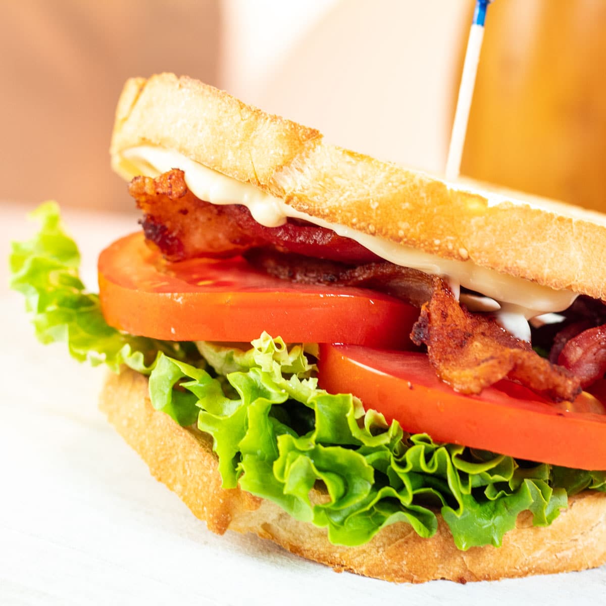 Square image of a homemade classic BLT sandwich.