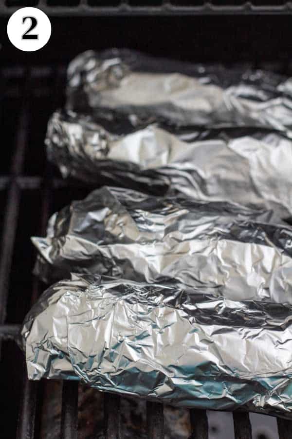 Process image 2 showing foil wrapped corn on the grill.