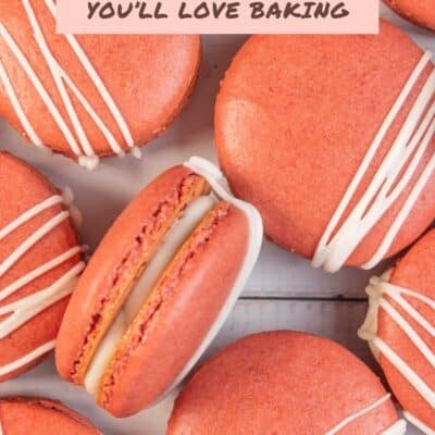 Best red velvet macaron recipe pin with text title over an image of the arranged macarons.