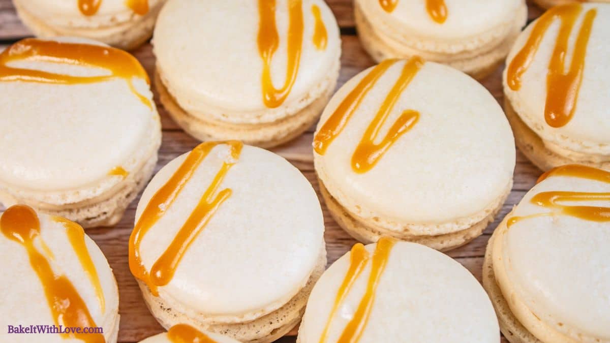 Horizontal image showing salted caramel macarons from above.