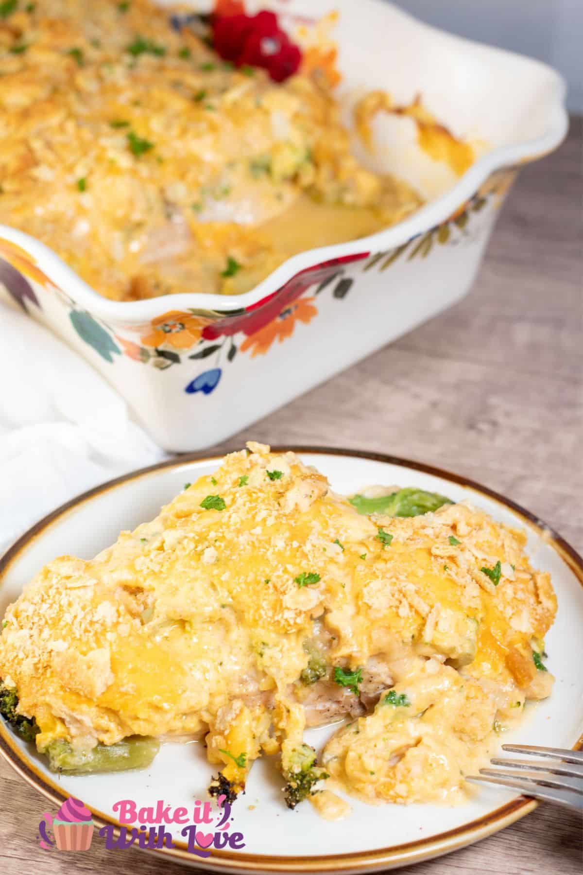 Cracker Barrel broccoli cheddar chicken served on tan plate with the casserole dish in background.