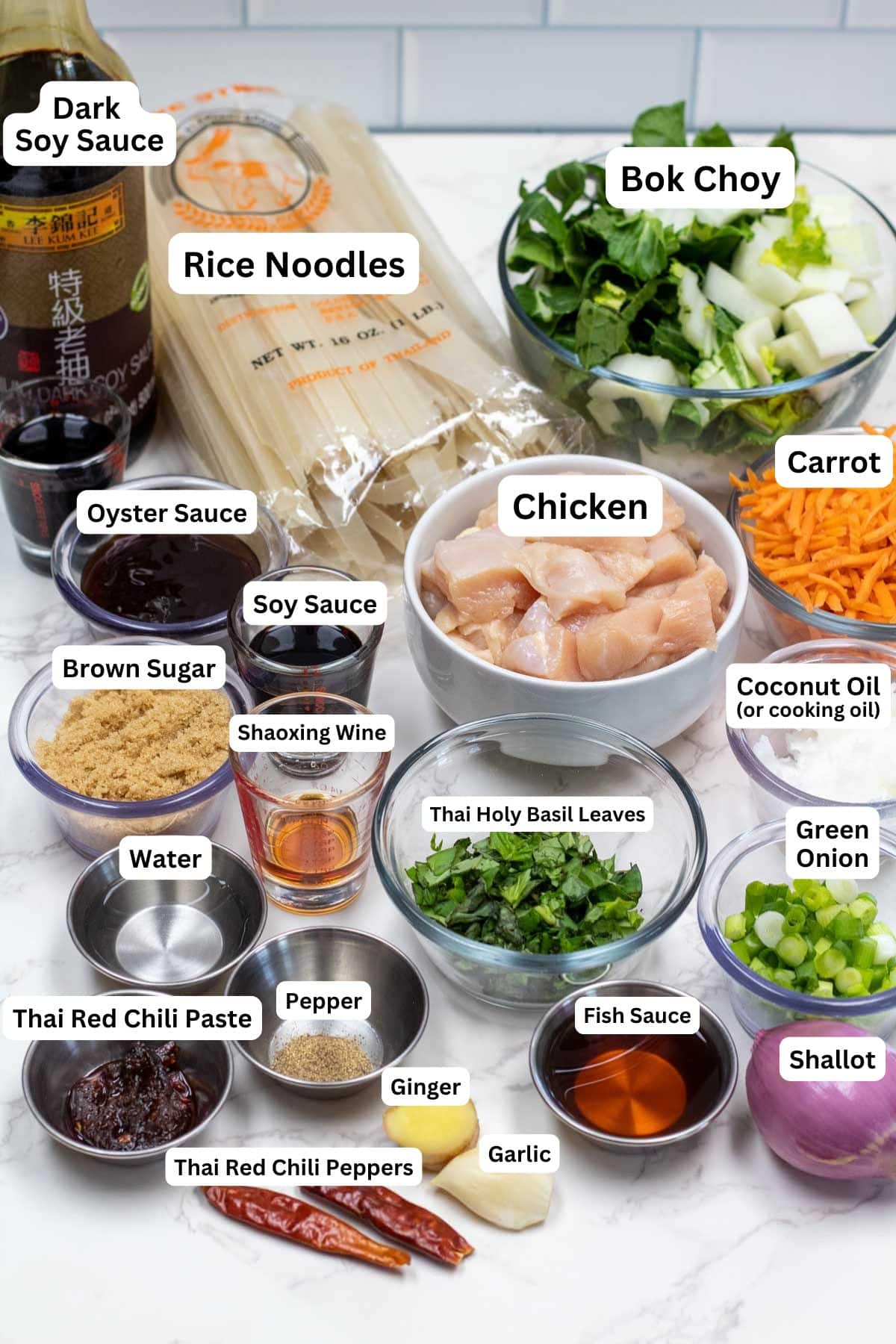 Tall image showing drunken noodles ingredients with labels.