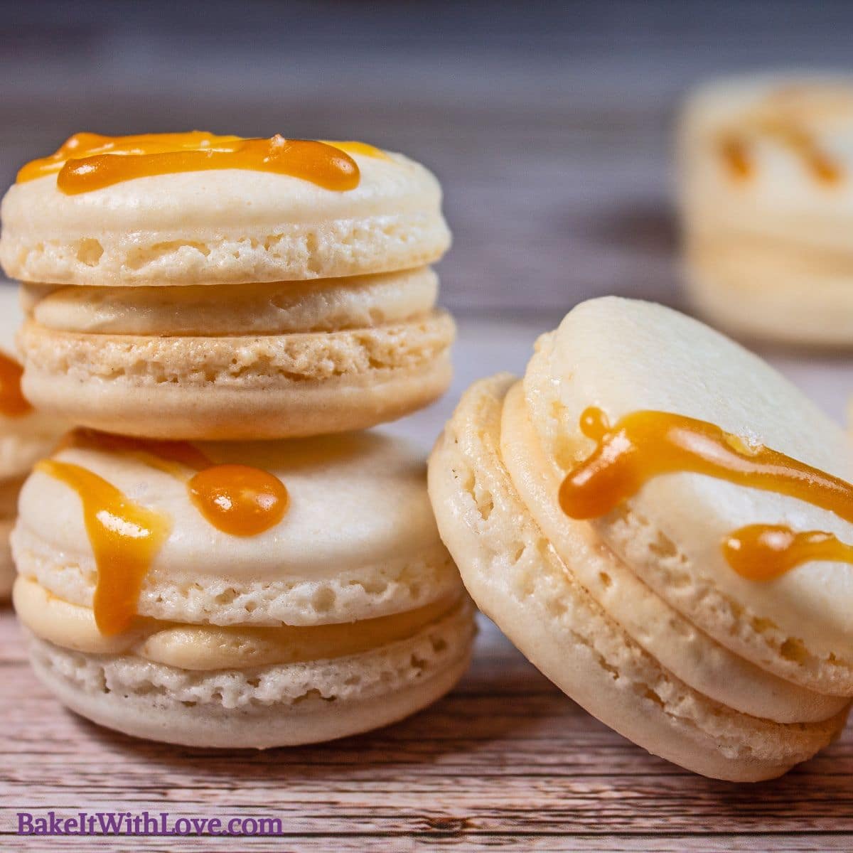 Three salted caramel macaroons topped with salted caramel drizzle.