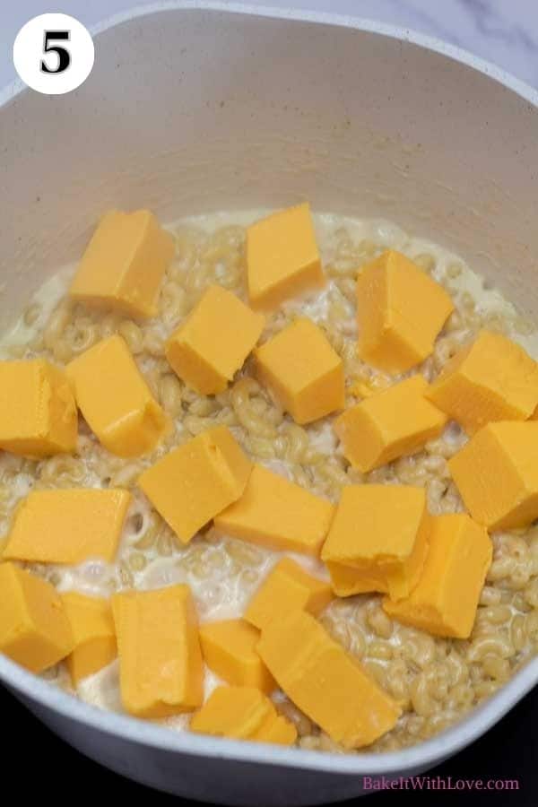 Velveeta mac and cheese process photo 5 add cubed Velveeta cheese to cooked pasta.