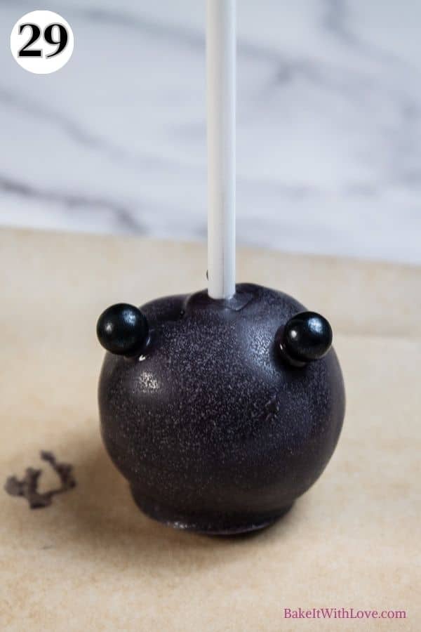 Halloween cake pops process photo 29 make the witch's bubbling cauldron add the round feet.