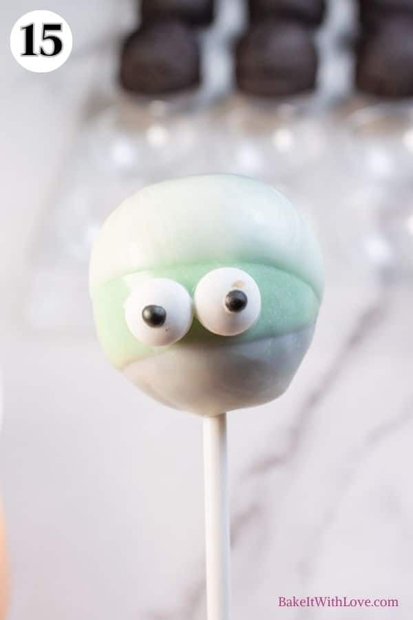 Monster cake pops process photo 15 make the mummy by adding the candy eyes on the green section.