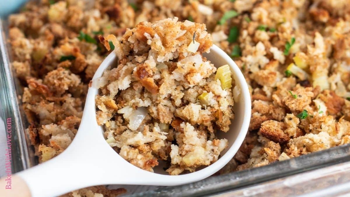 Wide closeup on the stuffing in serving spoon.