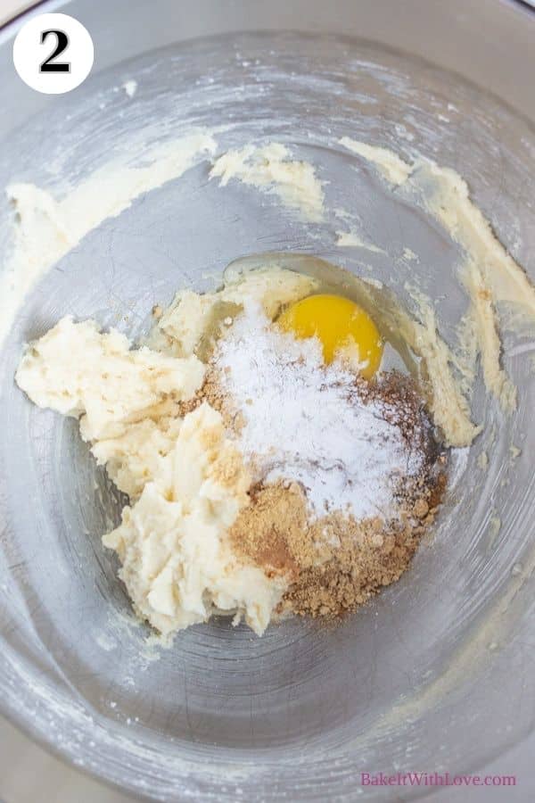 Gingerbread whoopie pies process photo 2 showing spices and an egg added to the creamed butter in a mixing bowl.