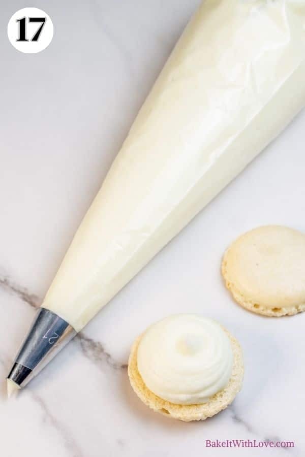 Toasted coconut macarons process photo 17 showing a piping bag with round tip full of ganache sitting next to an open macaron with a dollop of ganache on top.