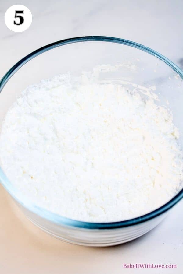 Grinch cookies process photo 5 showing cornstarch and confectioners sugar in a glass mixing bowl. 