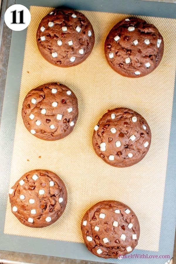 Hot chocolate cookies process photo 11 showing the completed, baked hot chocolate cookies on a silicone baking mat. 