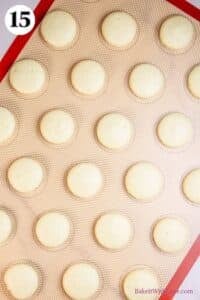 Mint chocolate macarons process photo 15 showing baked macaron shells on a silicone baking mat.