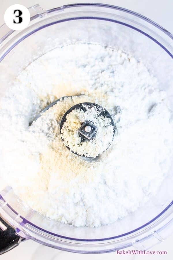 Peppermint macarons process photo 3 showing almond flour and confectioners sugar in the bowl of a food processor. 