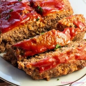 Lipton onion soup meatloaf sliced and ready to serve on platter.