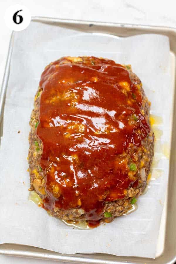 Process image 6 showing glaze added to partially cooked meatloaf.