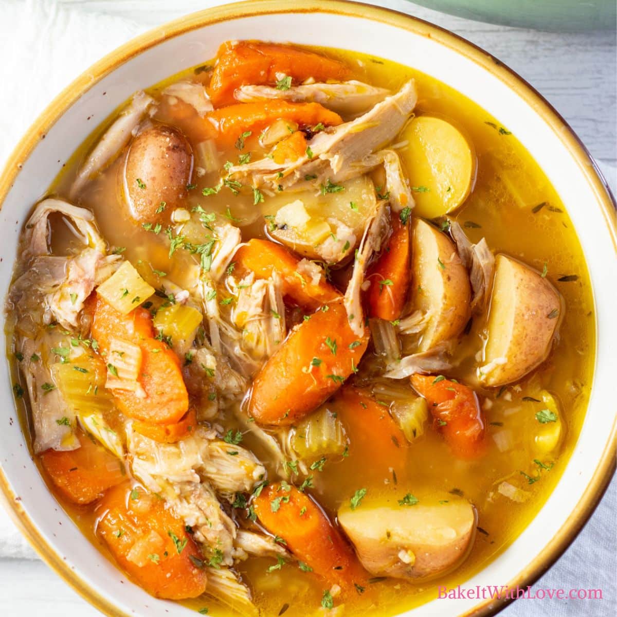 Square image of a bowl of rabbit stew.