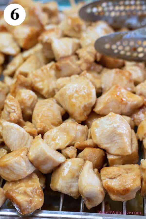 Panda Express black pepper chicken copycat recipe process photo 6 cooked chicken on a rack as its cooked in batches.