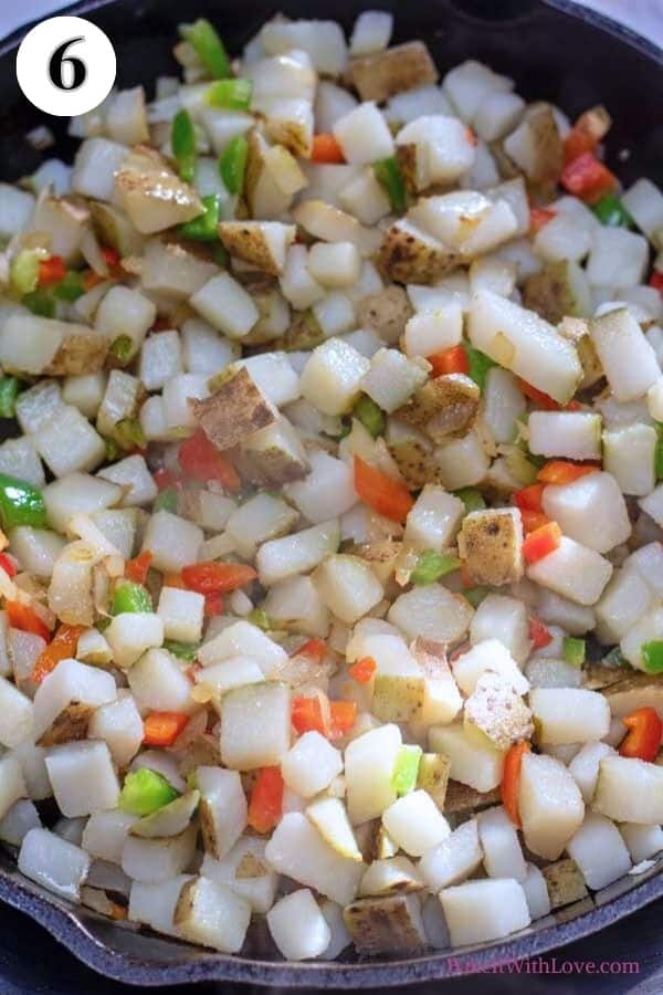 Process image 6 showing cooking combined potatoes, peppers and onions.