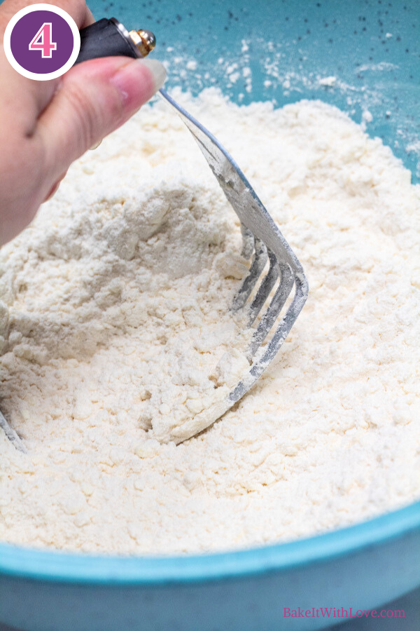 Master scones recipe process photo 4 work the butter into the flour using a pastry cutter or a pair of butter knives or a fork.