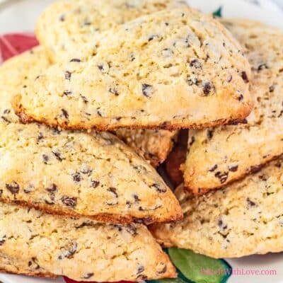 Delicious chocolate chip scones stacked on a plate to serve while warm.