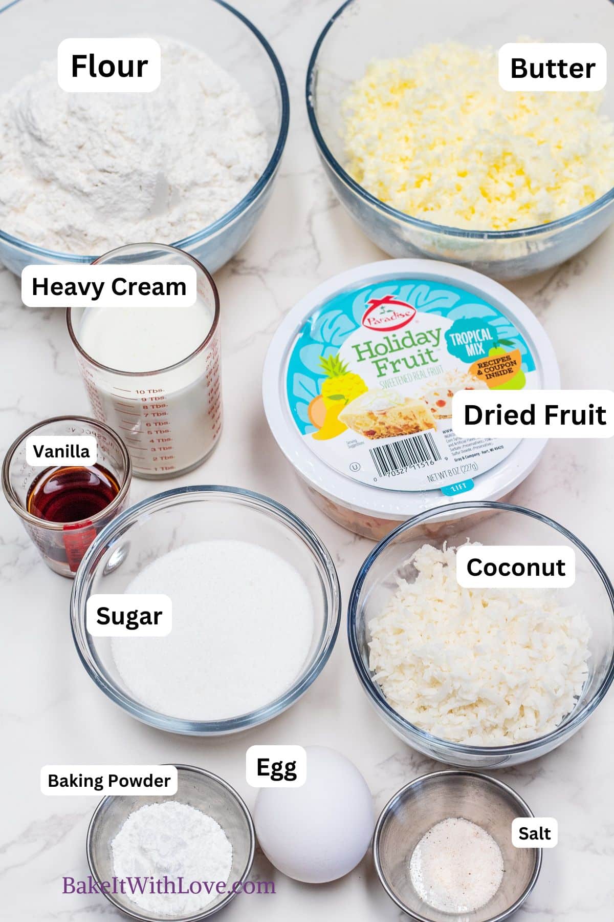 All of the ingredients you'll need to bake up these tropical fruit scones with labels on each pictured item.