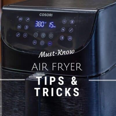 A Pinterest pin shows a black Cosori air fryer placed on a kitchen counter. The air fryer features a digital control panel on the front with various touch-sensitive buttons and a bright blue LED display indicating a temperature of 380°F and a timer set for 15 minutes. White text that reads 'Must-Know Air Fryer Tips & Tricks' overlayed.