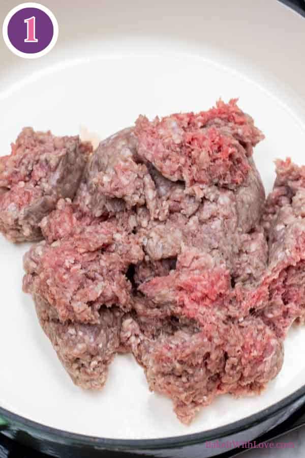 Hamburger pie casserole process photo 1 showing the partially-browned ground beef in a skillet.