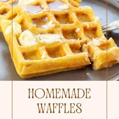 Pin image showing homemade waffles with maple syrup on a plate.